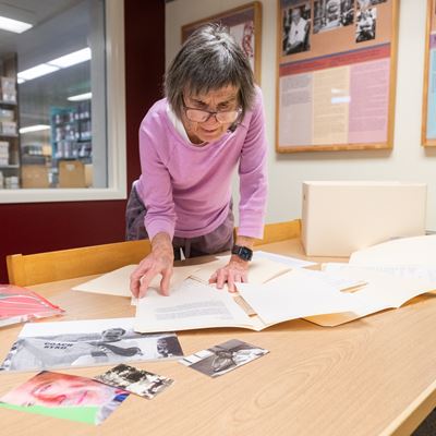 Photo of Lee Byrd looking through Bobby Byrd s collections at NMSU Archives and Special Collections