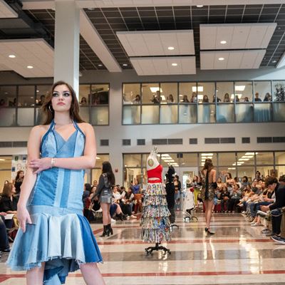 Students with New Mexico State University s Aggie Fashion Club modeling upcycled fashion designs