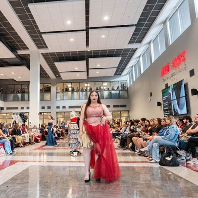 Students with New Mexico State University s Aggie Fashion Club modeling upcycled fashion designs