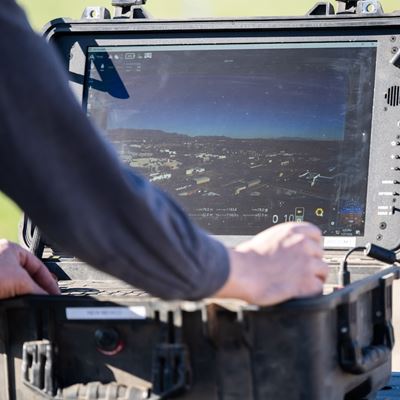 Man working on a laptop outdoors