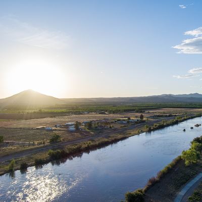 Photo of Picacho Mountain seen from above the Rio Grande river at sunset NMSU photo by Josh Bachman