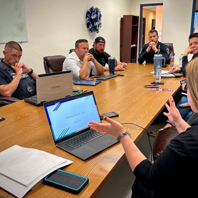 Photo of Erin Wahl associate professor with NMSU Library and command staff from LCPD