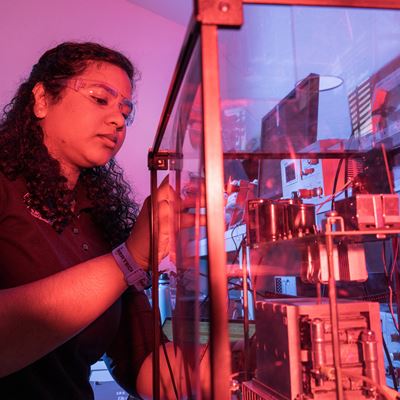 IMAGE DESCRIPTION Woman standing next to electrical equipment