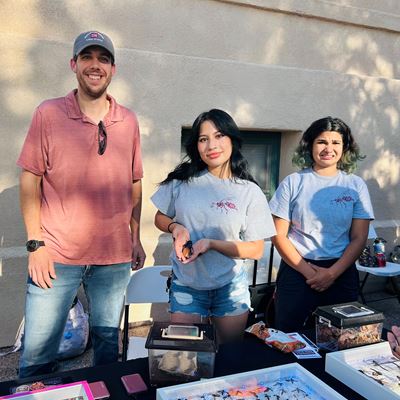 Photo of Alexis Olmos doing outreach at NMSU with the Entomology Club