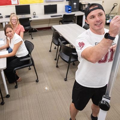 Photo of Blade Morris giving instruction to Adult Education students at the NMSU Grants campus