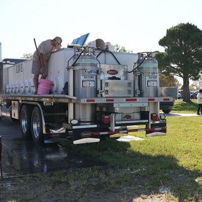 Photo of first fish stocking at Alumni Pond