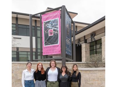 Five women standing together