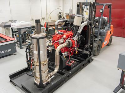 Description A large diesel engine with computer controls in a machine shop