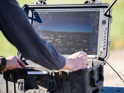 Man working on a laptop outdoors