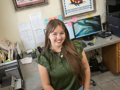 Photo of Kasi Montoya interning at Barker Produce