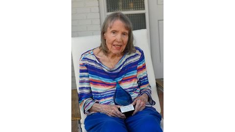 Carol Walker, the first woman to graduate from NMSU with a Ph.D., was honored during a drive by birthday celebration for