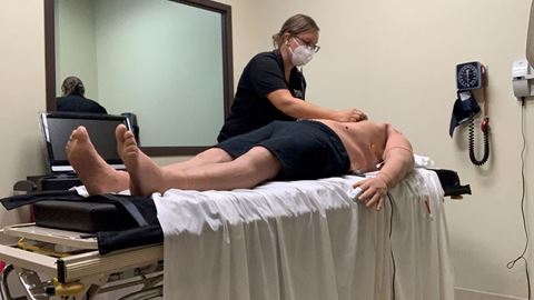 Katie Gimbel, a clinical assistant professor at St. Ambrose University in Iowa, demonstrates a physical assessment...