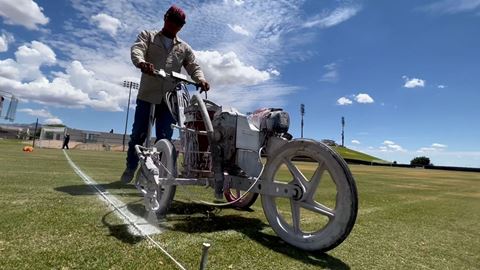 Grounds team striping fields