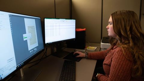 Emily Duke a communications disorder student working on a digitization project of the Amador family documents