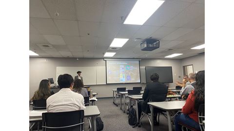A student giving a presentation in a classroom