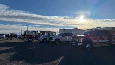 Emergency vehicles parked in a parking lot