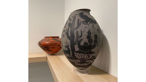 Two pieces of pottery on a shelf