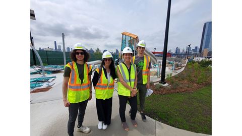 Four people on a construction site