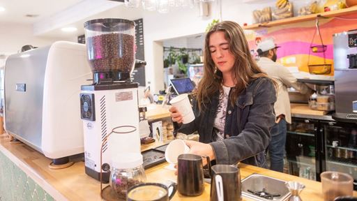 Photo of NMSU College of Business alumna Kendra Espiritu pictured at Grounded her family s locally owned business