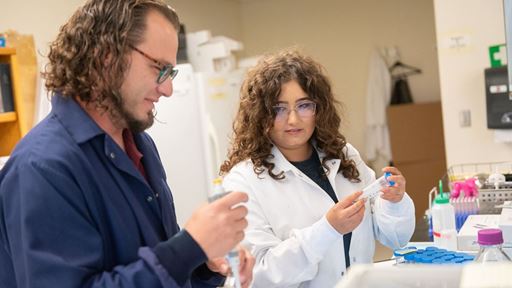 IMAGE DESCRIPTION A man and a woman working in a science laboratory