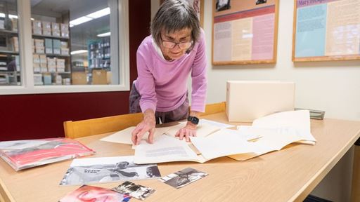 Photo of Lee Byrd looking through Bobby Byrd s collections at NMSU Archives and Special Collections