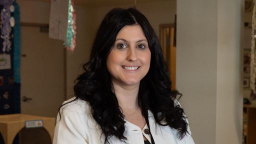 IMAGE DESCRIPTION A woman standing inside of a building