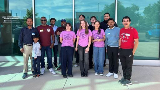 photo-of-new-mexico-state-university-students-gather-outside-the-wesst-enterprise-center-in-albuquer