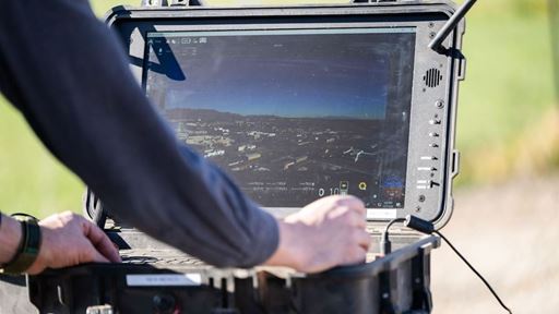 Man working on a laptop outdoors