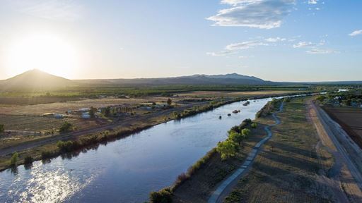 Photo of Picacho Mountain seen from above the Rio Grande river at sunset NMSU photo by Josh Bachman
