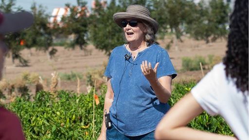 IMAGE DESCRIPTION Woman standing next to a garden