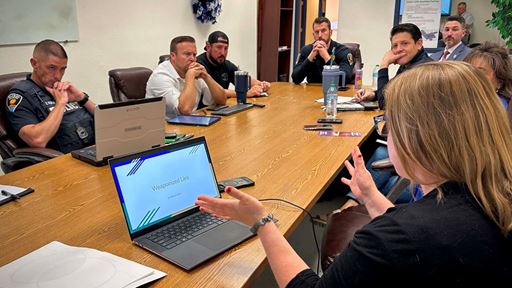 Photo of Erin Wahl associate professor with NMSU Library and command staff from LCPD