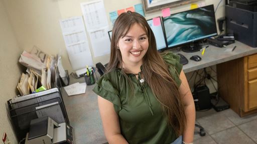 Photo of Kasi Montoya interning at Barker Produce