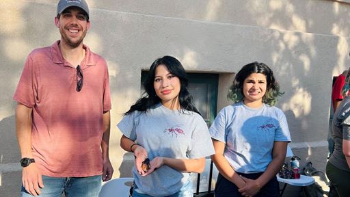 Photo of Alexis Olmos doing outreach at NMSU with the Entomology Club