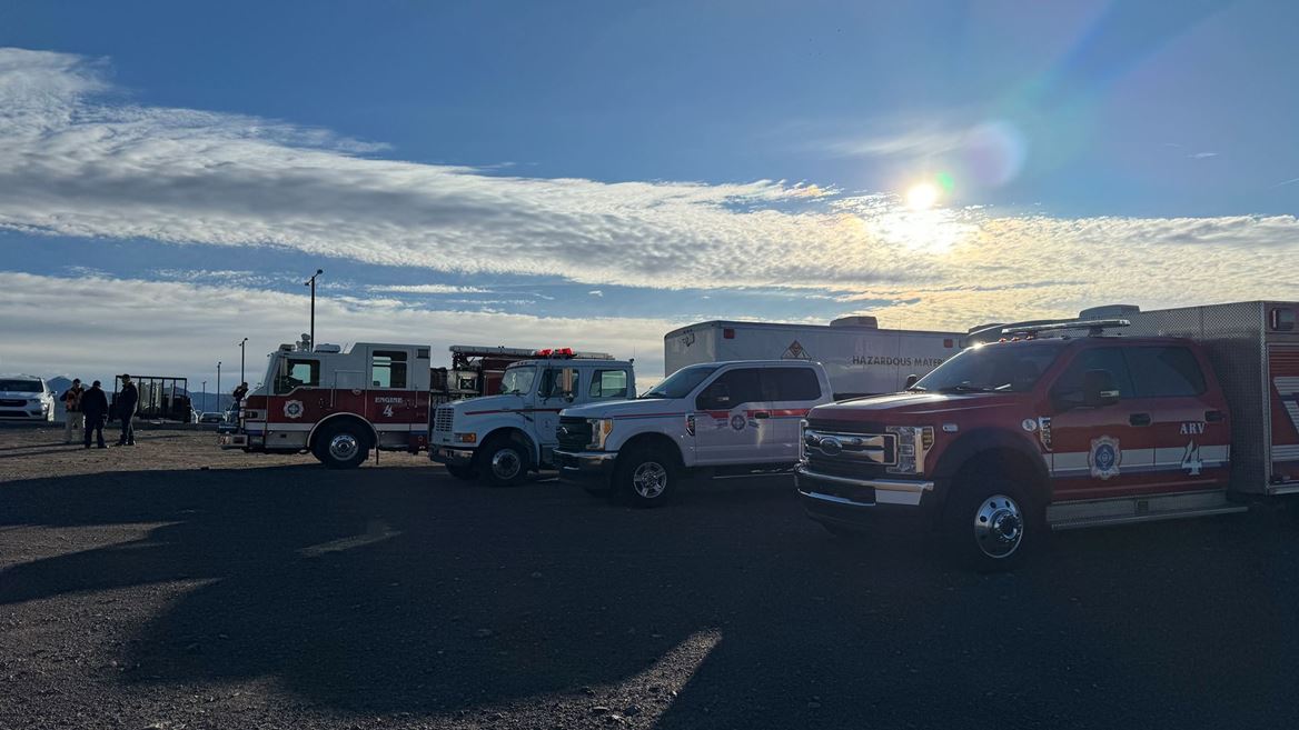 Emergency vehicles parked in a parking lot