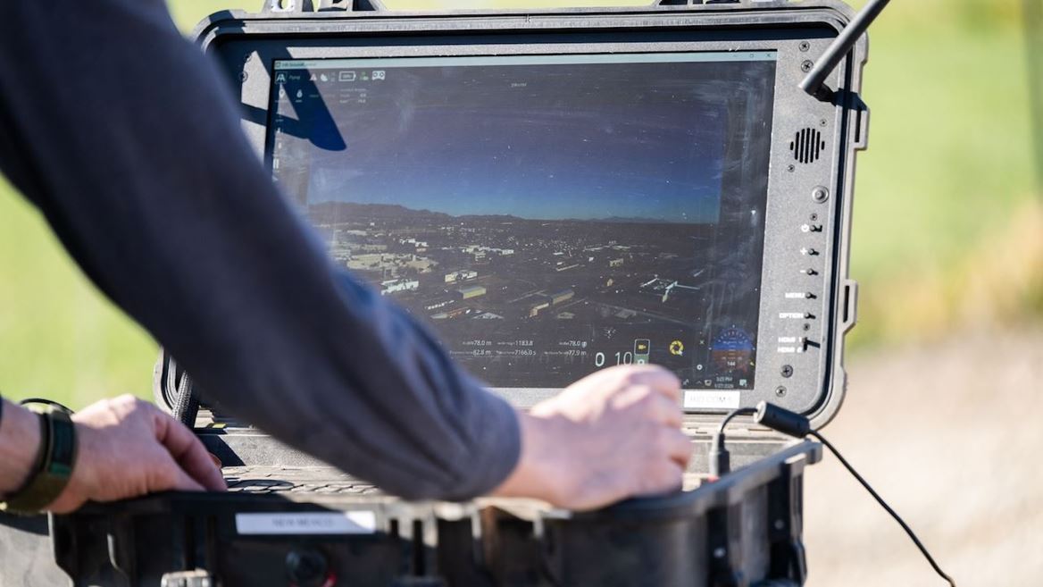 Man working on a laptop outdoors
