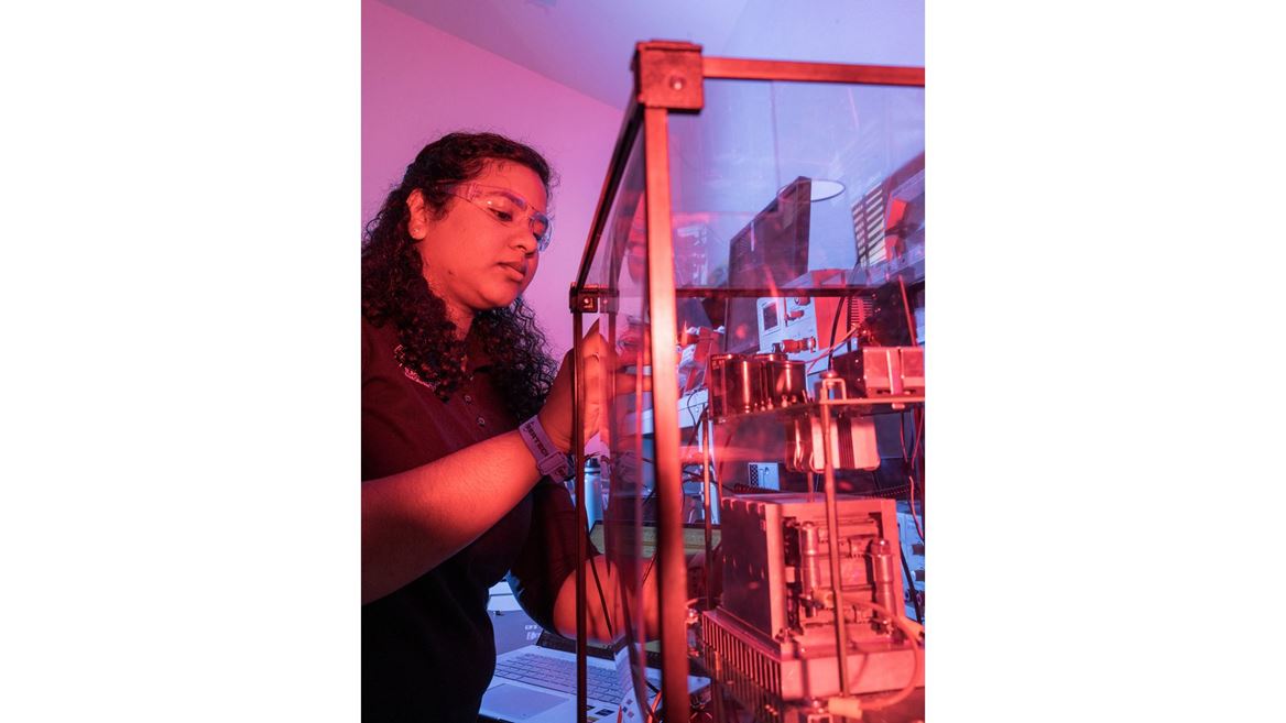 IMAGE DESCRIPTION Woman standing next to electrical equipment