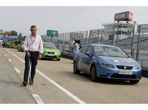 Javier del Hoyo heads to one of the SEAT cars he is going to drive with the help of an instructor Javier del Hoyo heads to one of the SEAT cars he is going to drive with the help of an instructor
