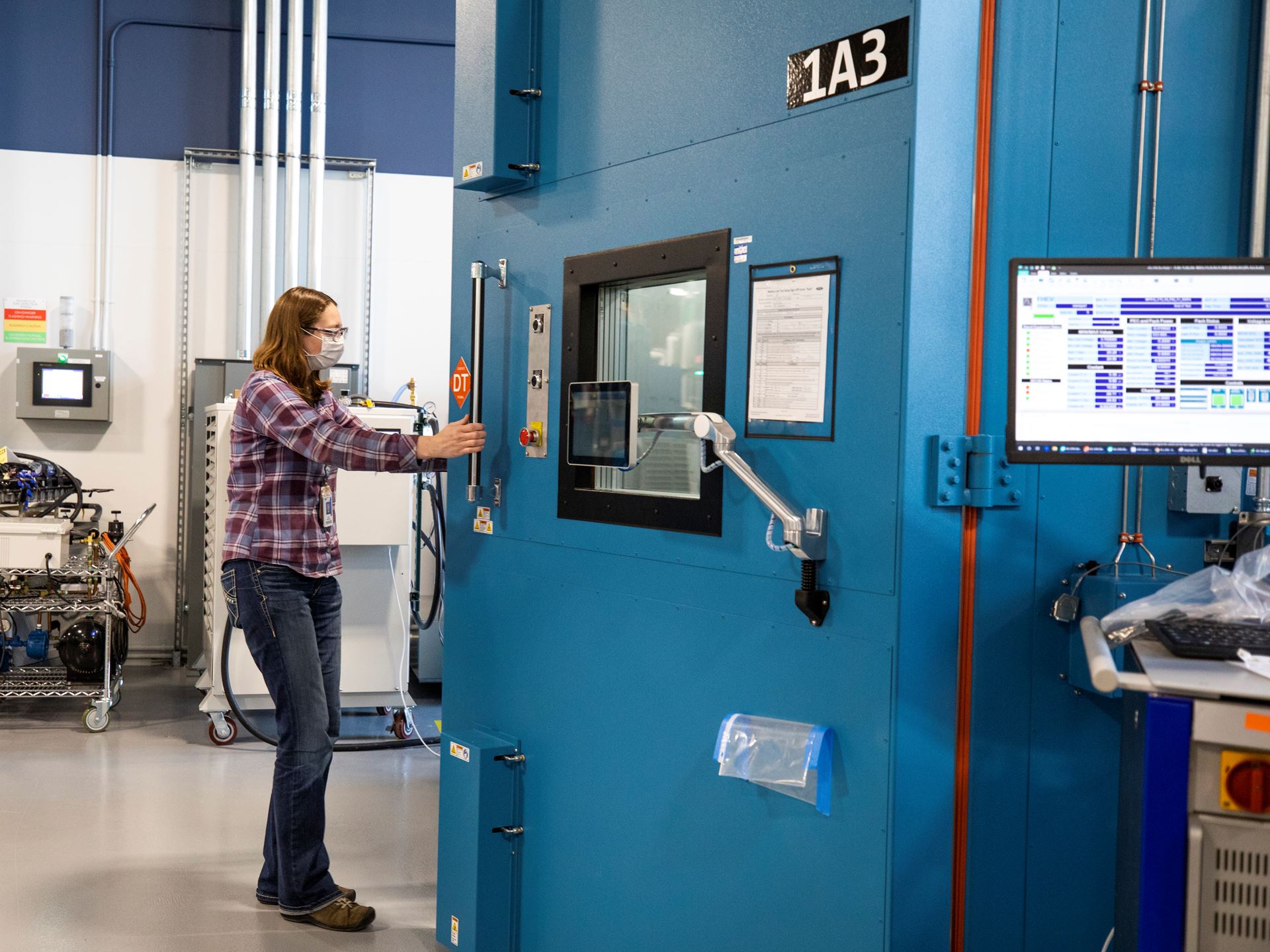 Mary Fredrick, Ford Motor Co. battery validation engineer, opens the