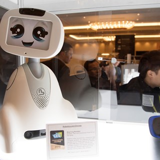 A Blue Frog Robotics robot is featured during the first day of CES