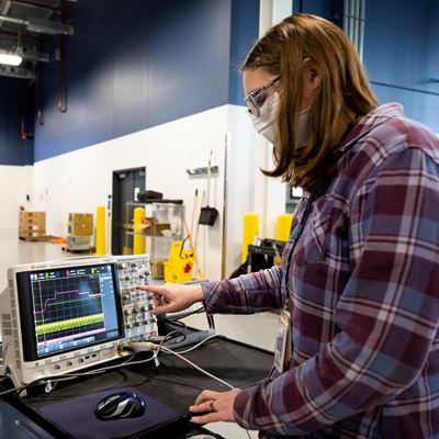 Mary Fedrick, Ford Motor Co. battery validation engineer, uses an Oscilloscope, a piece of equipment that captures quick