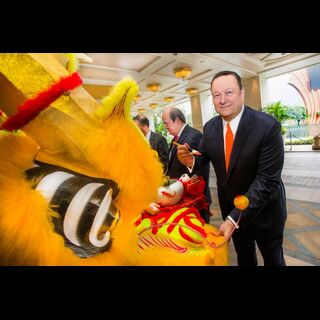Mr. Ian Michael Coughlan, President of Wynn Macau dotting the dragon's eyes for an auspicious Year of the Monkey
