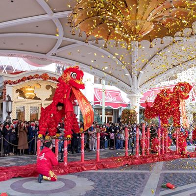 Wynn dragon and lion dance performances with the lighting of firecrackers