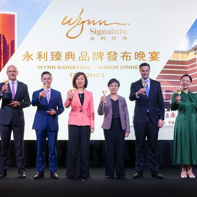 Officiating guests at the "Wynn Signature" launch dinner raise a toast to Wynn's new lifestyle brand