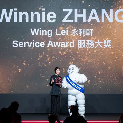 Ms. Winnie Zhang, Service Team Leader for Wing Lei, receives the MICHELIN Guide Service Award