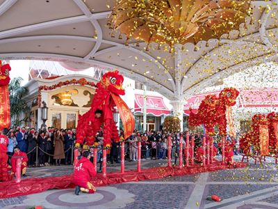 Wynn dragon and lion dance performances with the lighting of firecrackers