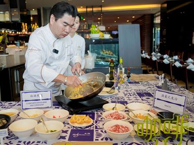 Celebrity Chef Raymond Vong gives a cooking demonstration for Qingdao residents and the media