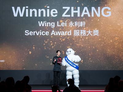 Ms. Winnie Zhang, Service Team Leader for Wing Lei, receives the MICHELIN Guide Service Award