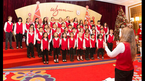 The TIS Crescendo Choir caroling at the lobby of Wynn Macau