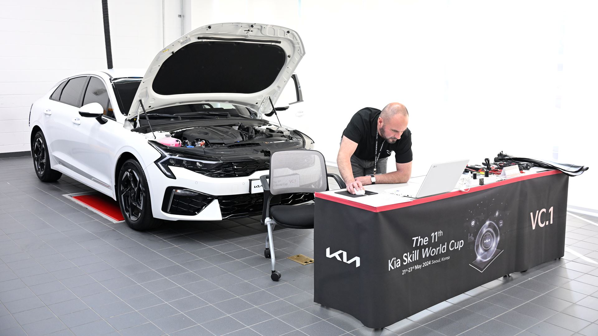 Kia Skill World Cup participant is taking vehicle practical test at Kia Osan Training Center, Korea