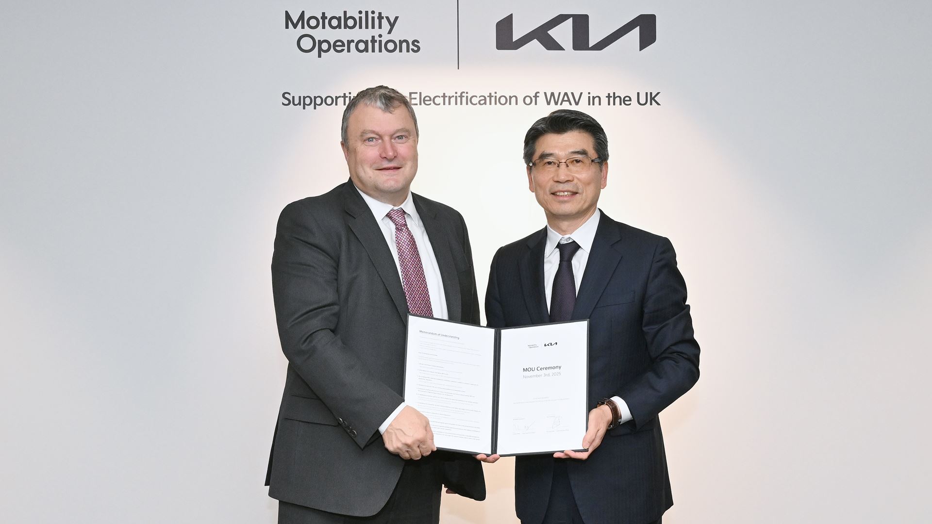 from left Andrew Miller CEO of Motability Operations and Ho Sung Song President and CEO of Kia Corporation